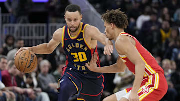 November 20, 2024; San Francisco, California, USA; Golden State Warriors guard Stephen Curry (30) dribbles the basketball against Atlanta Hawks guard Dyson Daniels (5) during the fourth quarter at Chase Center. Mandatory Credit: Kyle Terada-Imagn Images