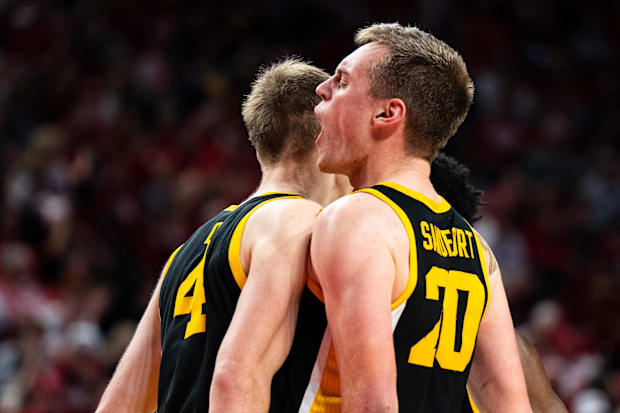 Iowa Hawkeyes forward Payton Sandfort (20) and guard Josh Dix (4) celebrate during the second half against Nebraska.
