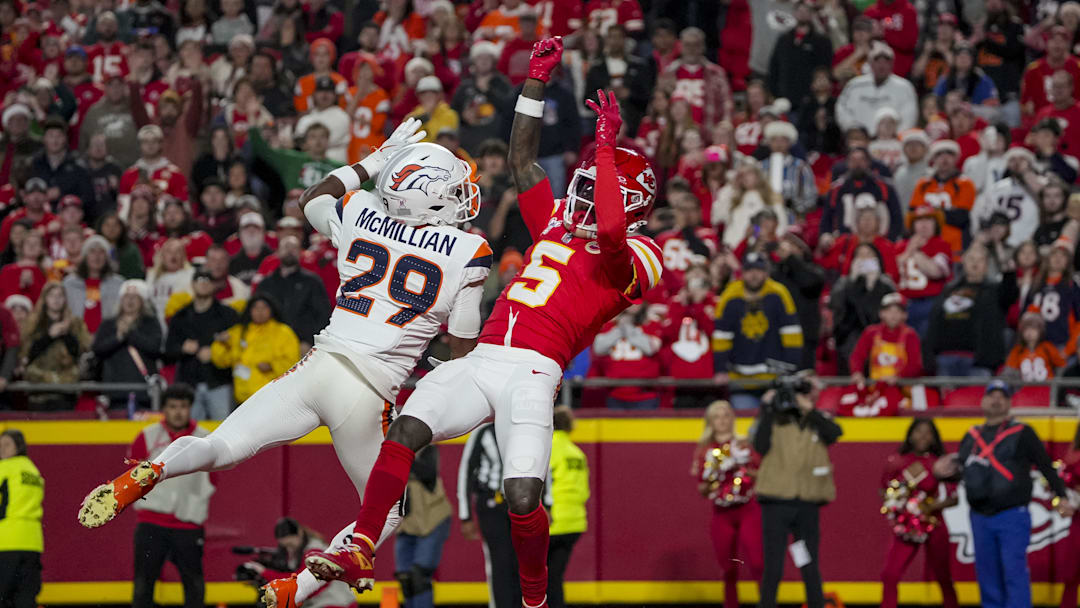 Dec 25, 2025; Kansas City, Missouri, USA; Kansas City Chiefs wide receiver Hollywood Brown (5) misses a catch against Kansas City Chiefs running back Kareem Hunt (29) at GEHA Field at Arrowhead Stadium. Mandatory Credit: Denny Medley-Imagn Images