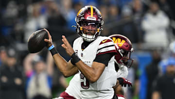 Jan 18, 2025; Detroit, Michigan, USA; Washington Commanders quarterback Jayden Daniels (5) throws a pass during the first quarter against Detroit Lions in a 2025 NFC divisional round game at Ford Field. Mandatory Credit: Lon Horwedel-Imagn Images