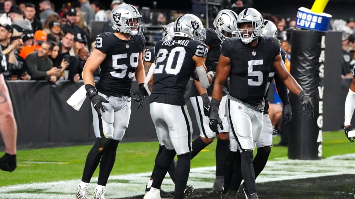 Jan 7, 2024; Paradise, Nevada, USA; Las Vegas Raiders players celebrate after Las Vegas Raiders safety Tre'von Moehrig (25) intercepted a Denver Broncos quarterback Jarrett Stidham (4) pass during the fourth quarter at Allegiant Stadium. Mandatory Credit: Stephen R. Sylvanie-USA TODAY Sports