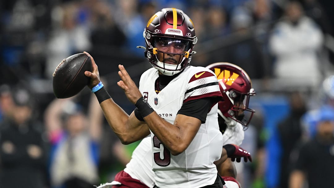 Jan 18, 2025; Detroit, Michigan, USA; Washington Commanders quarterback Jayden Daniels (5) throws a pass during the first quarter against Detroit Lions in a 2025 NFC divisional round game at Ford Field. Mandatory Credit: Lon Horwedel-Imagn Images