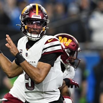 Jan 18, 2025; Detroit, Michigan, USA; Washington Commanders quarterback Jayden Daniels (5) throws a pass during the first quarter against Detroit Lions in a 2025 NFC divisional round game at Ford Field. Mandatory Credit: Lon Horwedel-Imagn Images