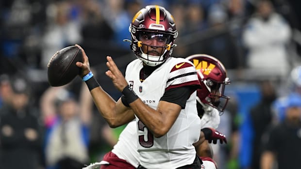 Jayden Daniels throws a pass during the first quarter against Detroit Lions