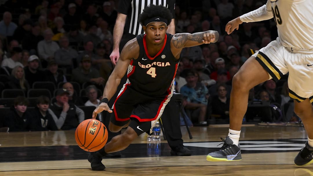 Feb 25, 2026; Nashville, Tennessee, USA;  Georgia Bulldogs guard Marcus Millender (4) drives baseline against the Vanderbilt Commodores during the first half at Memorial Gymnasium. Mandatory Credit: Steve Roberts-Imagn Images