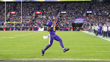 Nov 7, 2024; Baltimore, Maryland, USA; Baltimore Ravens quarterback Lamar Jackson (8) scores a two point conversion during the fourth quarter against the Cincinnati Bengals at M&T Bank Stadium. Mandatory Credit: Mitch Stringer-Imagn Images
