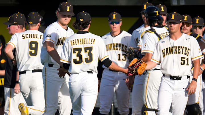 Iowa’s Cade Obermueller (33) high fives teammates between innings during a Big Ten conference baseball game against Oregon May 15, 2025 at Duane Banks Field in Iowa City, Iowa.