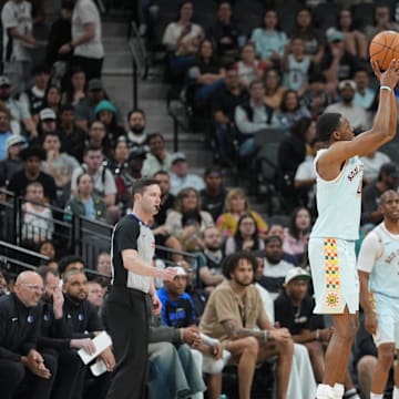 Mar 12, 2025; San Antonio, Texas, USA; San Antonio Spurs guard De'Aaron Fox (4) shoots in the second half against the Dallas Mavericks at Frost Bank Center. Mandatory Credit: Daniel Dunn-Imagn Images