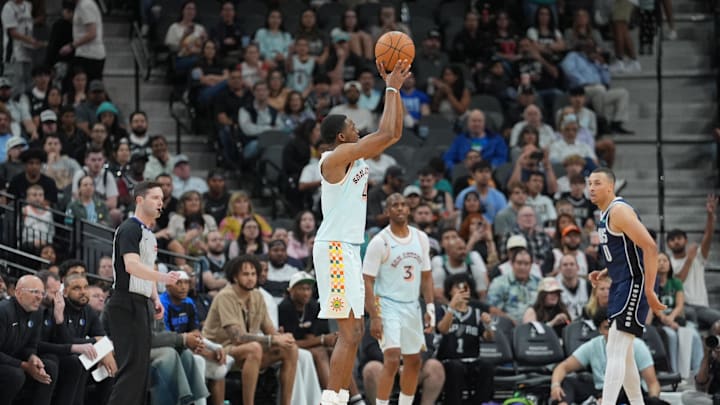 Mar 12, 2025; San Antonio, Texas, USA; San Antonio Spurs guard De'Aaron Fox (4) shoots in the second half against the Dallas Mavericks at Frost Bank Center. Mandatory Credit: Daniel Dunn-Imagn Images