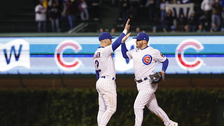 Sep 27, 2022; Chicago, Illinois, USA; Chicago Cubs shortstop Nico Hoerner (2) celebrates with left