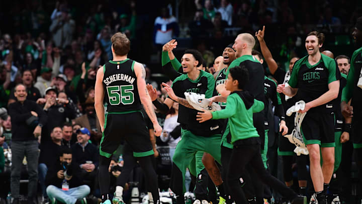 Boston Celtics forward Baylor Scheierman (55) reacts with the bench after hitting a three point shot 