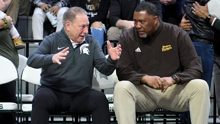 Dec 30, 2024; East Lansing, Michigan, USA; Michigan State Spartans head coach Tom Izzo chats with Western Michigan Broncos head coach Dwayne Stephens  at Jack Breslin Student Events Center. Mandatory Credit: Dale Young-Imagn Images