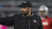 Oct 28, 2023; Madison, Wisconsin, USA;  Ohio State Buckeyes head coach Ryan Day gestures during warmups prior to the game against the Wisconsin Badgers at Camp Randall Stadium. Mandatory Credit: Jeff Hanisch-Imagn Images