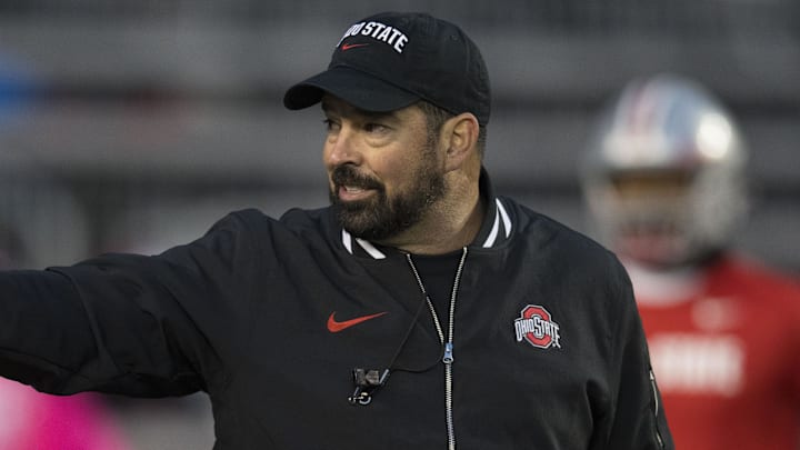 Oct 28, 2023; Madison, Wisconsin, USA;  Ohio State Buckeyes head coach Ryan Day gestures during warmups prior to the game against the Wisconsin Badgers at Camp Randall Stadium. Mandatory Credit: Jeff Hanisch-Imagn Images