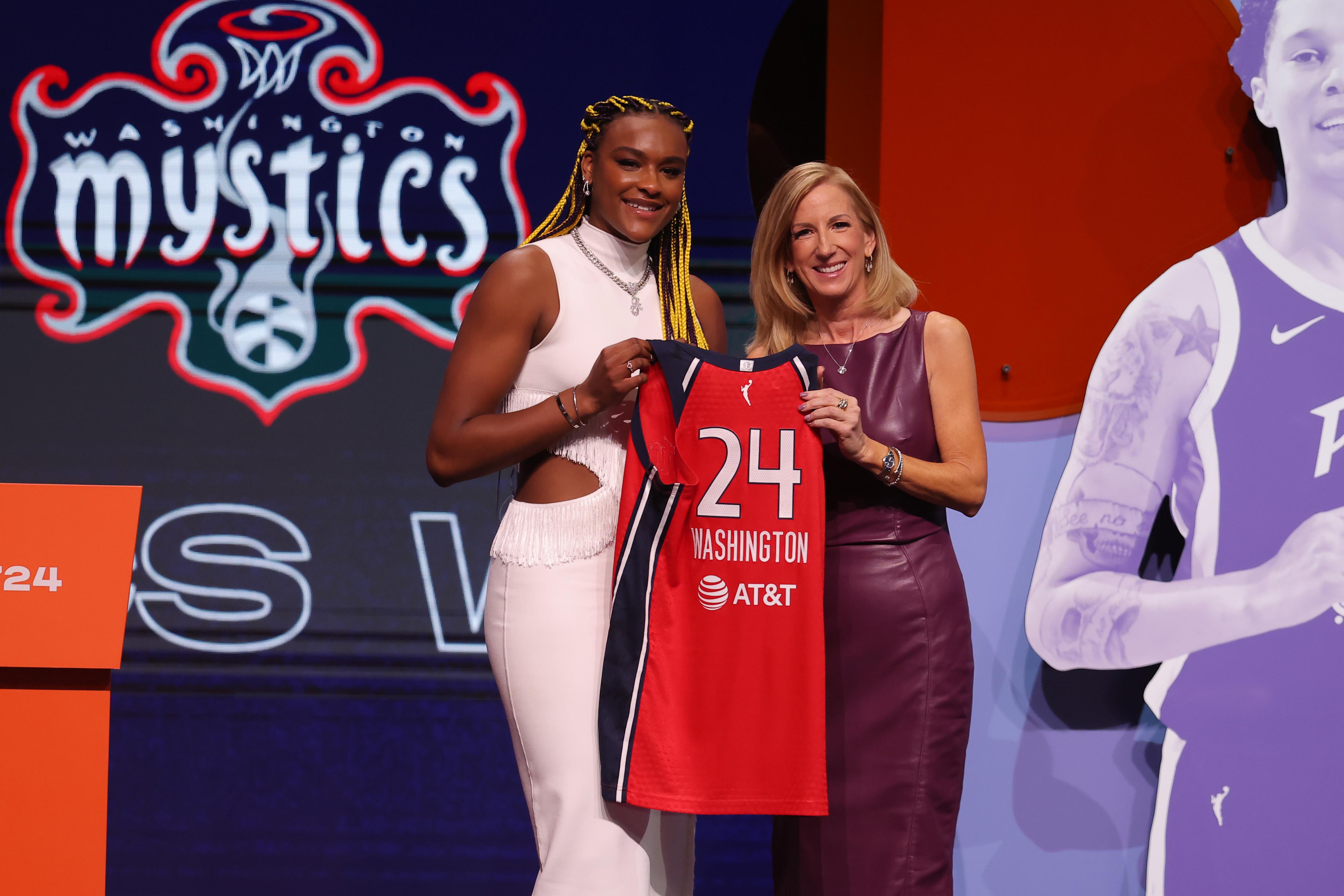 Aaliyah Edwards poses with WNBA commissioner Cathy Engelbert 