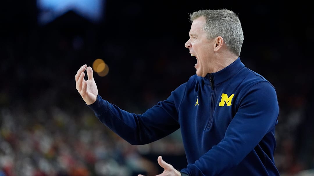 Michigan head coach Dusty May gestures on the court in the first half of their Final Four game against Arizona at Lucas Oil Stadium in Indianapolis on Saturday, April 4, 2026.