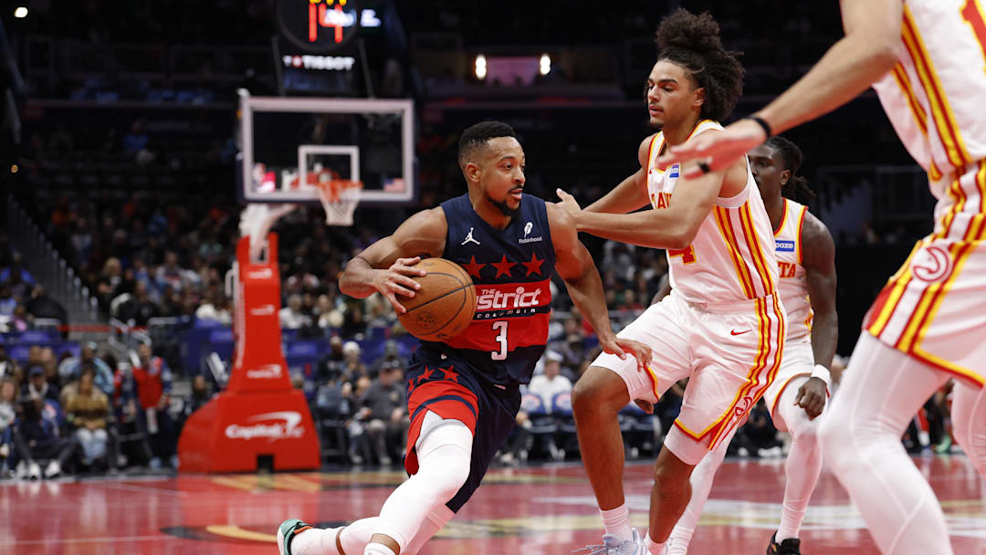 Nov 25, 2025; Washington, District of Columbia, USA; Washington Wizards guard CJ McCollum (3) drives to the basket as Atlanta Hawks forward Asa Newell (14) defends in the second half at Capital One Arena. Mandatory Credit: Geoff Burke-Imagn Images Nov 25, 2025; Washington, District of Columbia, USA; Washington Wizards guard CJ McCollum (3) drives to the basket as Atlanta Hawks forward Asa Newell (14) defends in the second half at Capital One Arena. Mandatory Credit: Geoff Burke-Imagn Images