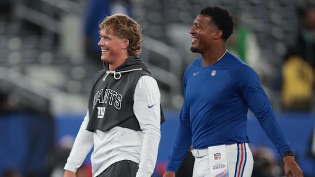 New York Giants quarterback Jaxson Dart, left, and quarterback Jameis Winston