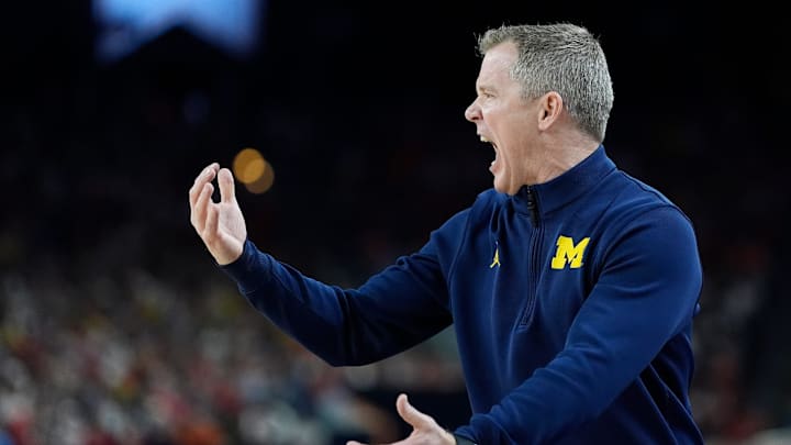 Michigan head coach Dusty May gestures on the court in the first half of their Final Four game against Arizona at Lucas Oil Stadium in Indianapolis on Saturday, April 4, 2026.