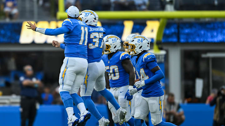 Aug 10, 2024; Inglewood, California, USA; Los Angeles Chargers safety Tony Jefferson (37) celebrates with quarterback Luis Perez (11) and other teammates after scoring a touchdown against the Seattle Seahawks during the third quarter at SoFi Stadium. Mandatory Credit: Jonathan Hui-Imagn Images