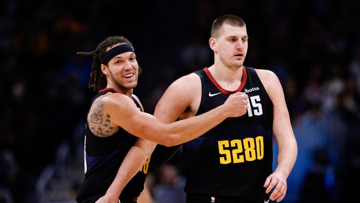 Dec 18, 2023; Denver, Colorado, USA; Denver Nuggets forward Aaron Gordon (50) reacts with center Nikola Jokic (15) in the third quarter against the Dallas Mavericks at Ball Arena.