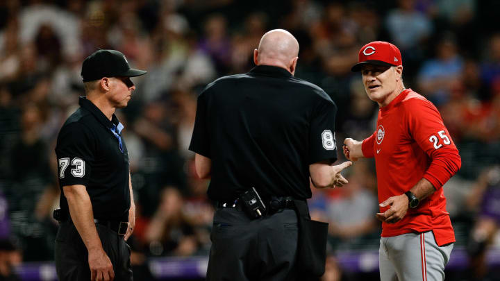 Jun 3, 2024; Denver, Colorado, USA; Cincinnati Reds manager David Bell (25) argues a call with home plate umpire Mike Estabrook (83) and first base umpire Tripp Gibson (73) in the eighth inning against the Colorado Rockies at Coors Field. Mandatory Credit: Isaiah J. Downing-USA TODAY Sports