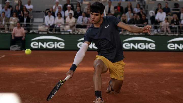 Jun 9, 2024; Paris, France; Carlos Alcaraz of Spain returns a shot during the men’s singles final against Alexander Zverev of Germany on day 15 of Roland Garros at Stade Roland Garros. Mandatory Credit: Susan Mullane-USA TODAY Sports