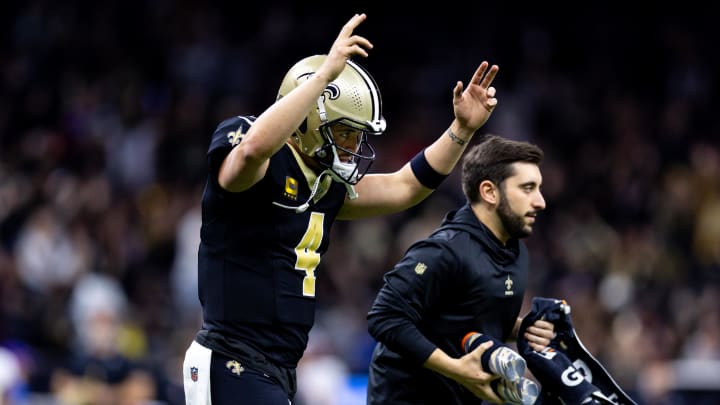 Jan 7, 2024; New Orleans, Louisiana, USA;  New Orleans Saints quarterback Derek Carr (4) reacts to a touchdown against the Atlanta Falcons during the first half at Caesars Superdome. Mandatory Credit: Stephen Lew-USA TODAY Sports