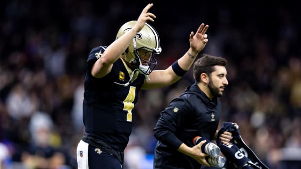 New Orleans Saints quarterback Derek Carr (4) reacts to a touchdown against the Atlanta Falcons.