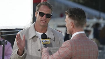 Nov 28, 2025; Starkville, Mississippi, USA; Mississippi Rebels head coach Lane Kiffin speaks with ESPN reporter Marty Smith before the game against the Mississippi State Bulldogs.