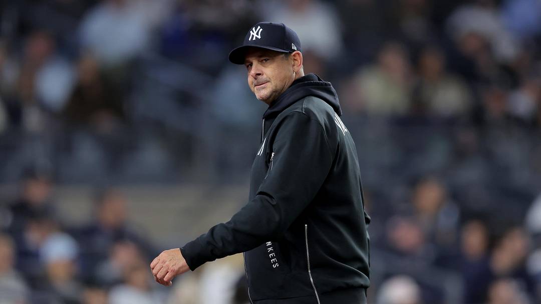Aaron Boone walks off the field after making a pitching change during the eighth inning against the Tampa Bay Rays.