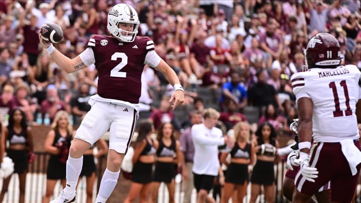 Aug 31, 2024; Starkville, Mississippi, USA; Mississippi State Bulldogs quarterback Blake Shapen (2) jumps into the endzone against Eastern Kentucky Colonels linebacker Maddox Marcellus (11) during the first quarter at Davis Wade Stadium at Scott Field. Mandatory Credit: Matt Bush-USA TODAY Sports