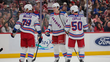Apr 14, 2025; Sunrise, Florida, USA; New York Rangers center Matt Rempe (73) celebrates with defenseman K'Andre Miller (79) and left wing Will Cuylle (50) after scoring against the Florida Panthers during the first period at Amerant Bank Arena. Mandatory Credit: Sam Navarro-Imagn Images