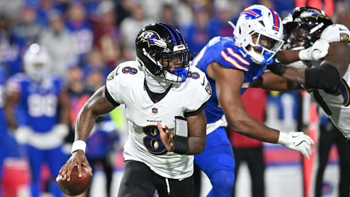 Sep 7, 2025; Orchard Park, New York, USA;  Baltimore Ravens quarterback Lamar Jackson (8) runs the ball during the fourth quarter against the Buffalo Bills at Highmark Stadium. Mandatory Credit: Mark Konezny-Imagn Images