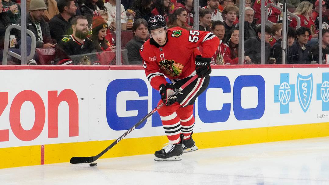 Nov 26, 2025; Chicago, Illinois, USA; Chicago Blackhawks defenseman Artyom Levshunov (55) skates with the puck against the Minnesota Wild during the first period at United Center. Mandatory Credit: David Banks-Imagn Images