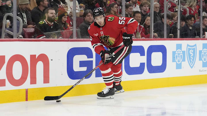 Nov 26, 2025; Chicago, Illinois, USA; Chicago Blackhawks defenseman Artyom Levshunov (55) skates with the puck against the Minnesota Wild during the first period at United Center. Mandatory Credit: David Banks-Imagn Images