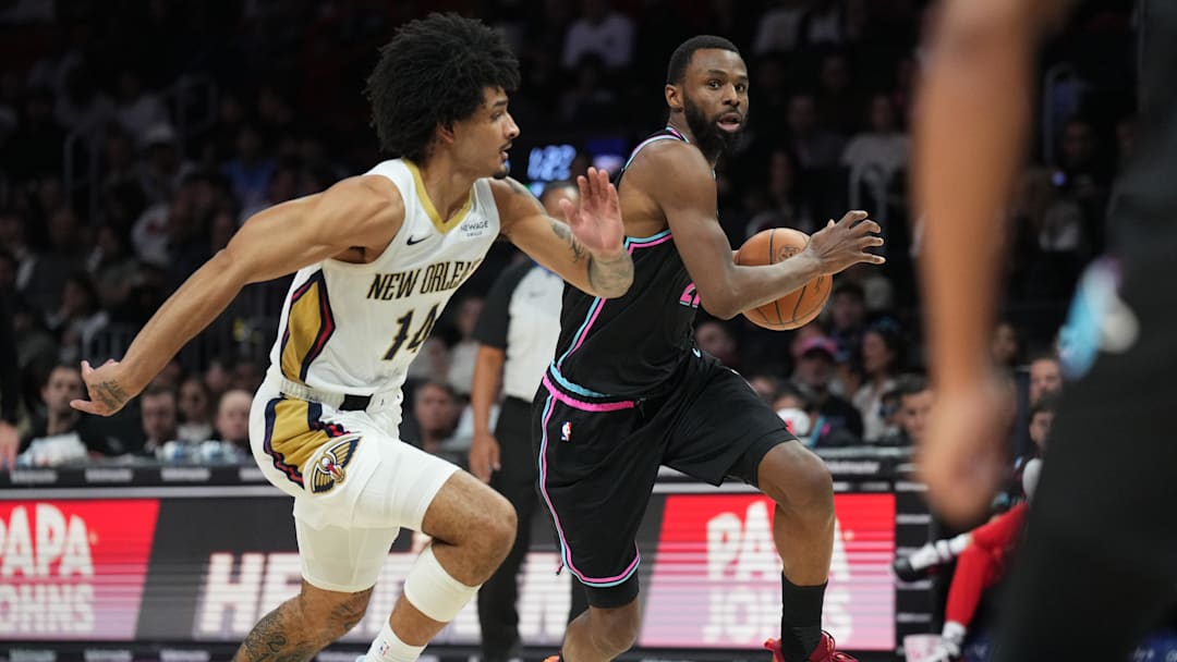 Jan 4, 2026; Miami, Florida, USA; Miami Heat forward Andrew Wiggins (22) brings the ball up the court as New Orleans Pelicans guard Micah Peavy (14) defends during the first half at Kaseya Center. Mandatory Credit: Jim Rassol-Imagn Images Jan 4, 2026; Miami, Florida, USA; Miami Heat forward Andrew Wiggins (22) brings the ball up the court as New Orleans Pelicans guard Micah Peavy (14) defends during the first half at Kaseya Center. Mandatory Credit: Jim Rassol-Imagn Images