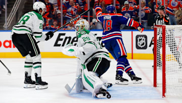 May 25, 2025; Edmonton, Alberta, CAN; Edmonton Oilers left wing Zach Hyman (18) celebrates after he scores a goal against Dallas Stars goaltender Jake Oettinger (29) as defenseman Alexander Petrovic (28) looks on during the third period in game three of the Western Conference Final of the 2025 Stanley Cup Playoffs at Rogers Place. Mandatory Credit: Perry Nelson-Imagn Images