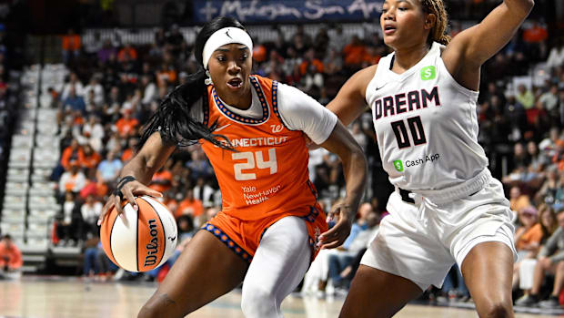 Connecticut Sun forward Aneesah Morrow (24) battles Atlanta Dream forward Naz Hillmon (00) to the basket