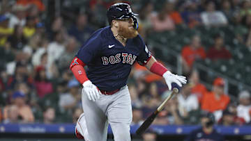 Aug 22, 2023; Houston, Texas, USA; Boston Red Sox designated hitter Justin Turner (2) hits a single