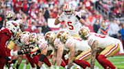 Jan 5, 2025; Glendale, Arizona, USA; San Francisco 49ers quarterback Joshua Dobbs (5) calls a play against the Arizona Cardinals in the first half at State Farm Stadium. Mandatory Credit: Mark J. Rebilas-Imagn Images