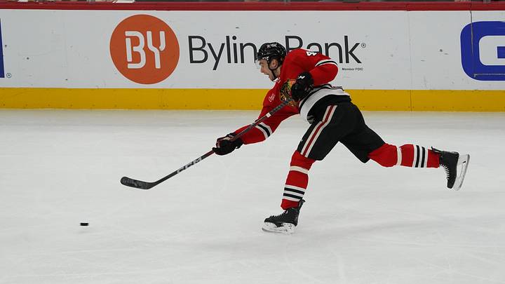 Jan 1, 2026; Chicago, Illinois, USA; Chicago Blackhawks defenseman Louis Crevier (46) shoots the puck against the Dallas Stars during the third period at United Center. Mandatory Credit: David Banks-Imagn Images