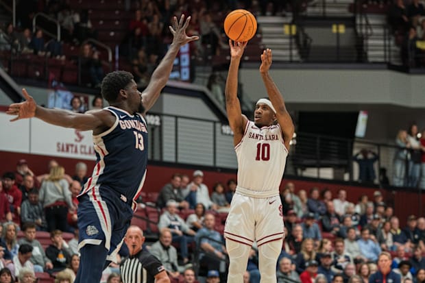 Santa Clara's Carlos Stewart Jr. (10) shoots a three point basket against Gonzaga's Graham Ike (13). 