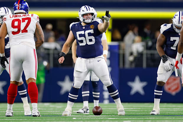 Dallas Cowboys center Cooper Beebe signals at the line against the New York Giants.