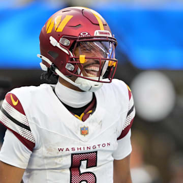 Oct 5, 2025; Inglewood, California, USA; Washington Commanders quarterback Jayden Daniels (5) celebrates after a touchdown against the Los Angeles Chargers in the second half at SoFi Stadium. Mandatory Credit: Jayne Kamin-Oncea-Imagn Images