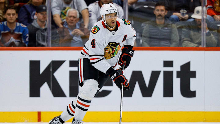 Oct 28, 2024; Denver, Colorado, USA; Chicago Blackhawks defenseman Seth Jones (4) controls the puck in the third period against the Colorado Avalanche at Ball Arena. Mandatory Credit: Isaiah J. Downing-Imagn Images