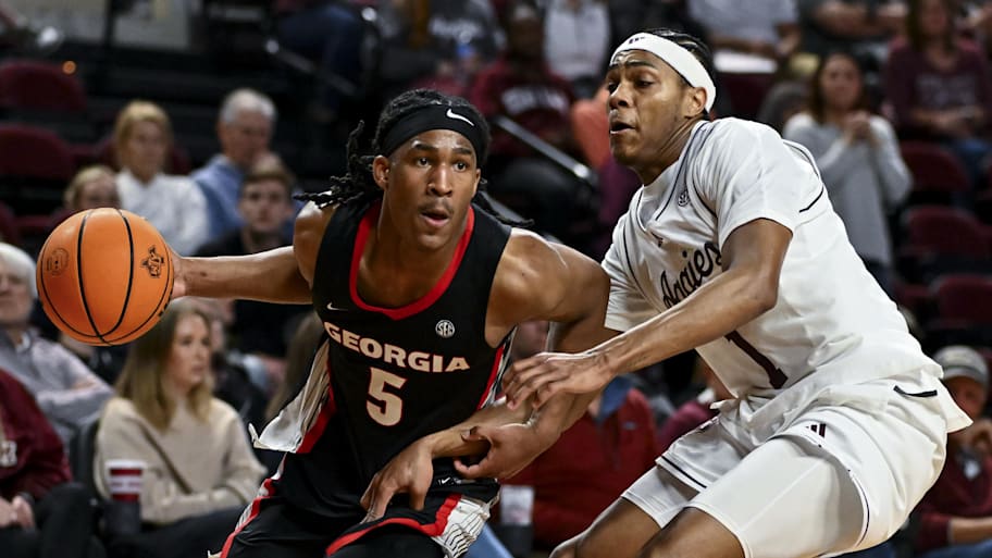 Georgia Bulldogs guard Silas Demary Jr. (5) drives against Texas A&M guard Zhuric Phelps.