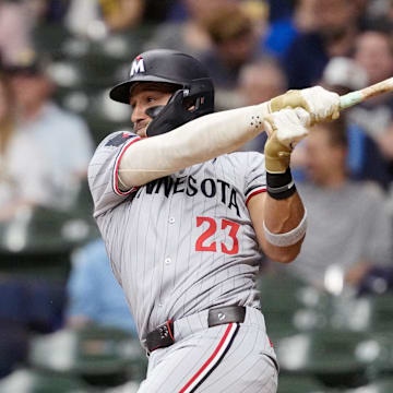 May 16, 2025; Milwaukee, Wisconsin, USA;  Minnesota Twins third baseman Royce Lewis (23) singles during the fourth inning against the Milwaukee Brewers at American Family Field.