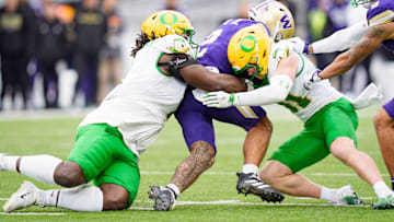 The Ducks locked up a home playoff game by smashing the Huskies to complete an 11-1 season.