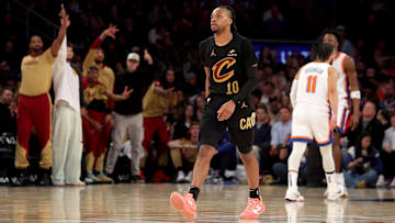 Apr 11, 2025; New York, New York, USA; Cleveland Cavaliers guard Darius Garland (10) and the Cavalier bench react after his three point shot against the New York Knicks during the fourth quarter at Madison Square Garden. Mandatory Credit: Brad Penner-Imagn Images